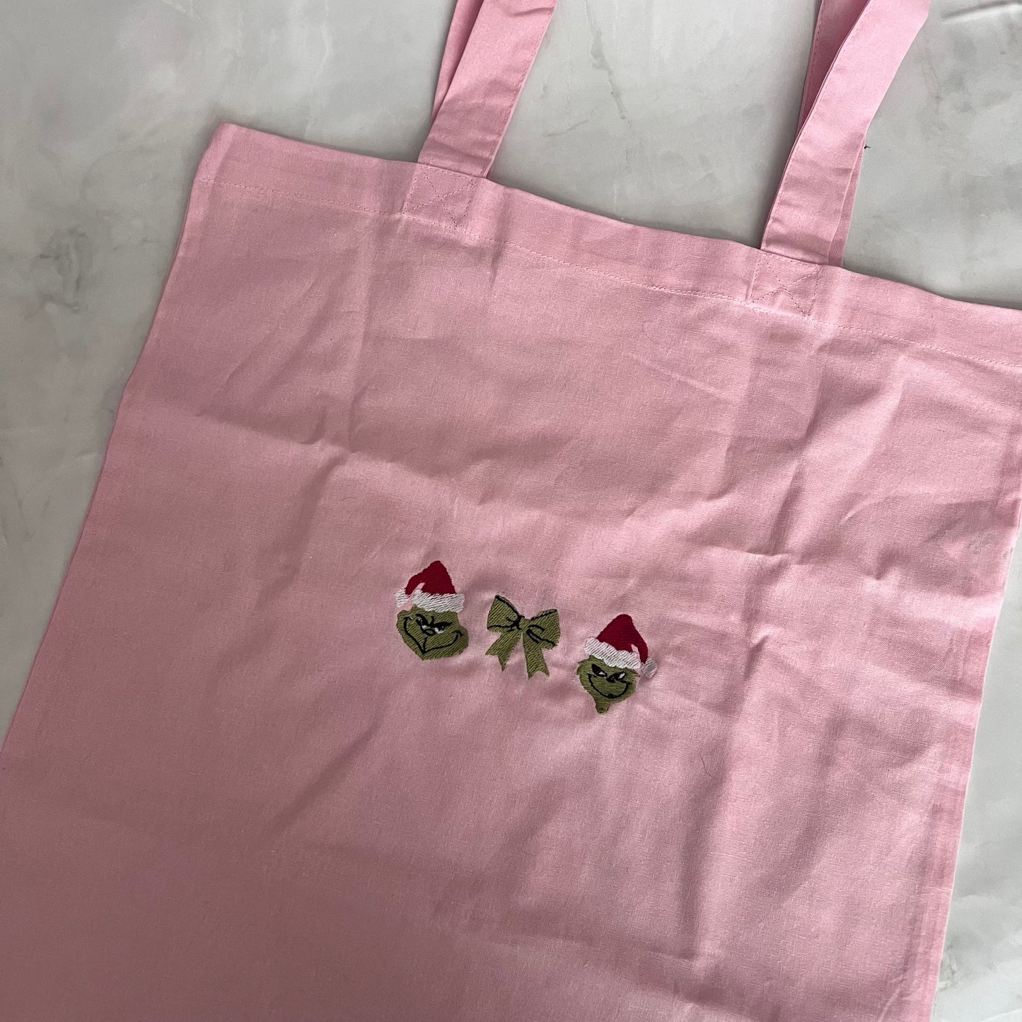 Grinch bow tote bag